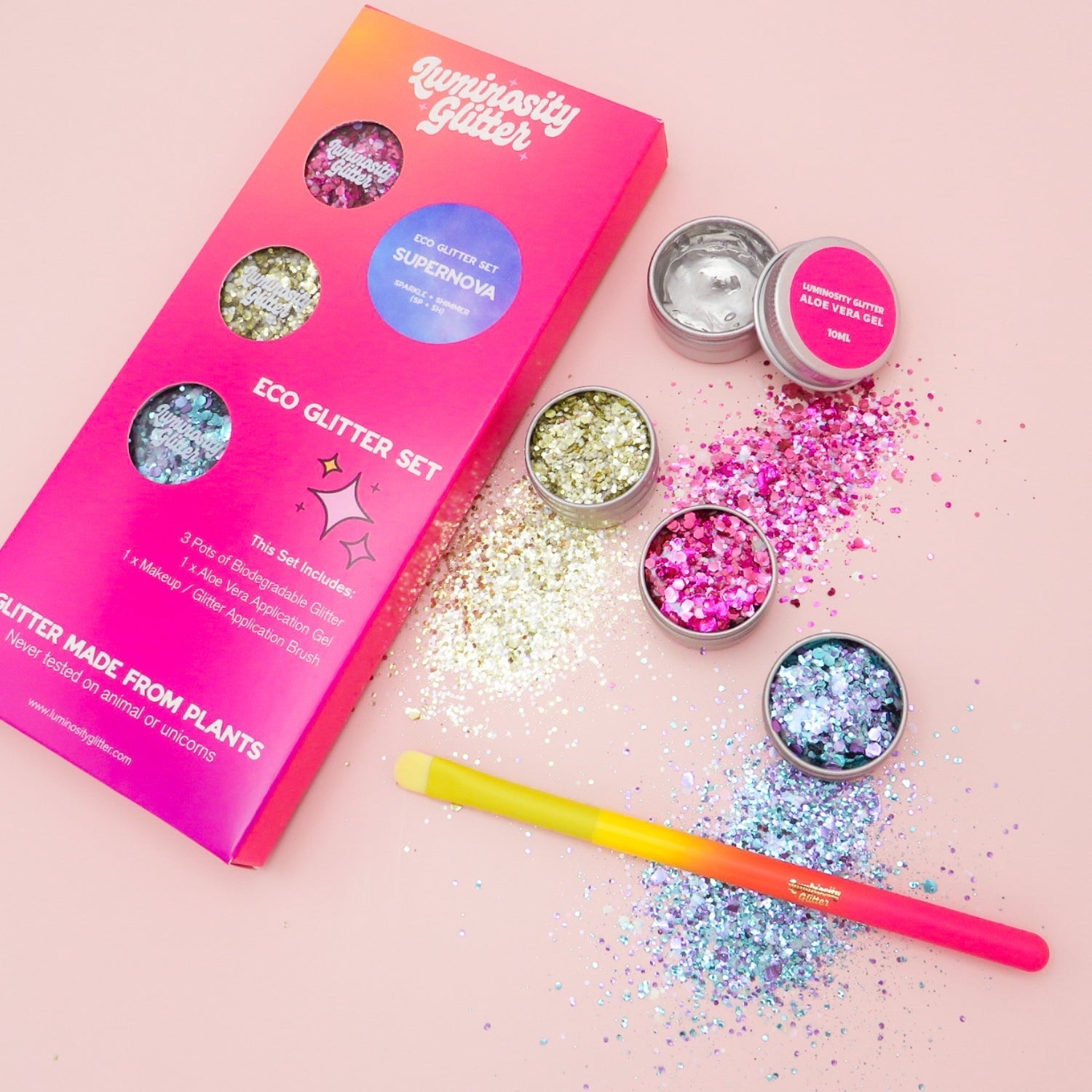 Tropic like it's hot biodegradable glitter gift set with three glitters, a hot pink makeup brush and aloe vera application gel