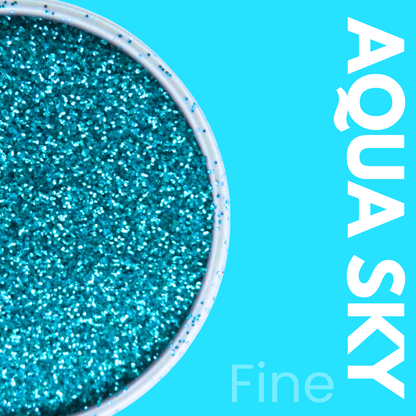Close-up of turquoise glitter with 'Aqua Sky' text on a blue background