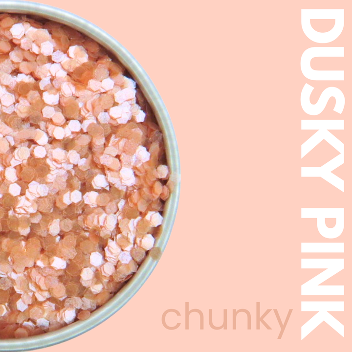 Bowl of pink bath salts with &