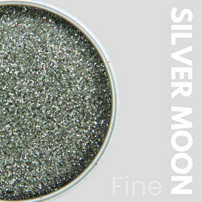 Silver glitter in a container with 'SILVER MOON' text on a gray background