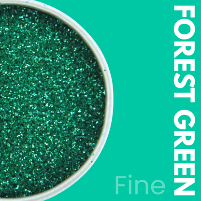 Close-up of forest green glitter in a container with 'FOREST GREEN' text on a teal background.