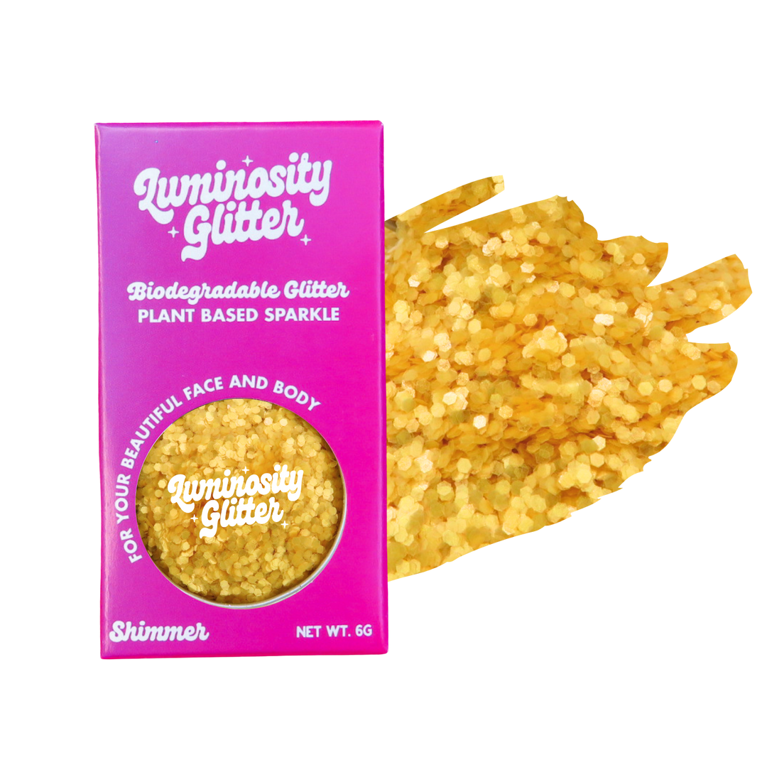 Luminosity Glitter packaging with yellow glitter on a white background