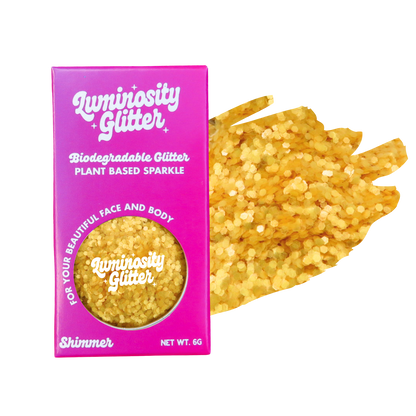 Luminosity Glitter packaging with yellow glitter on a white background