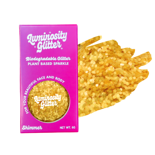 Luminosity Glitter packaging with yellow glitter on a white background