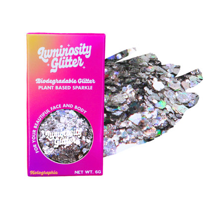 Luminosity Glitter packaging with holographic glitter on a white background