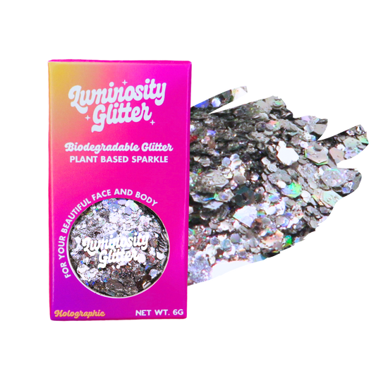 Luminosity Glitter packaging with holographic glitter on a white background