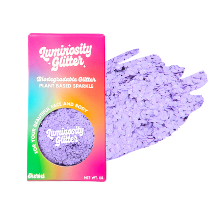 Luminosity Glitter packaging with purple glitter on a white background