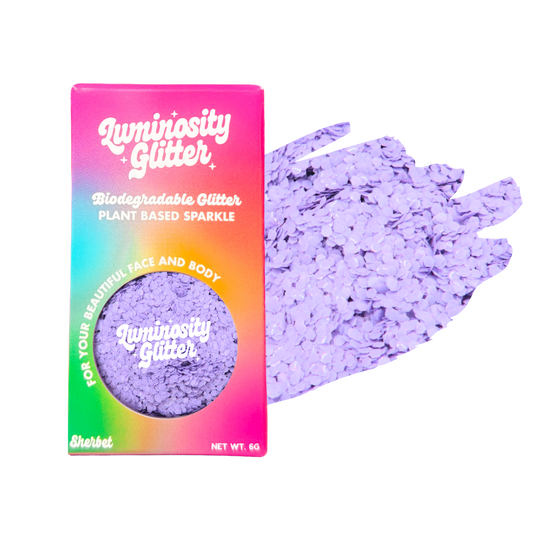 Luminosity Glitter packaging with purple glitter on a white background