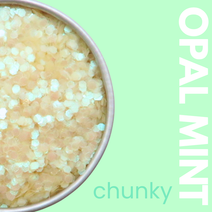 Opal mint chunky glitter in a container with a light green background
