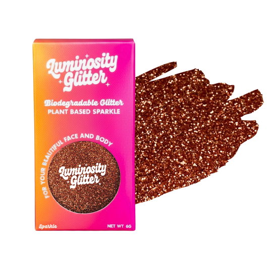 Luminosity Glitter packaging with brown glitter on a white background