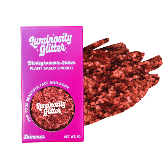 Luminosity Glitter packaging with red glitter on a white background