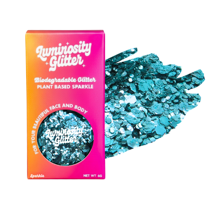 Luminosity Glitter packaging with blue glitter on a white background