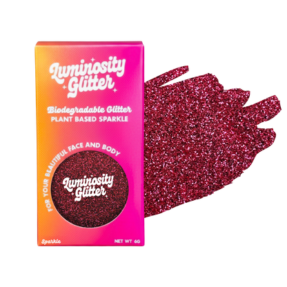 Luminosity Glitter packaging with red glitter on a white background