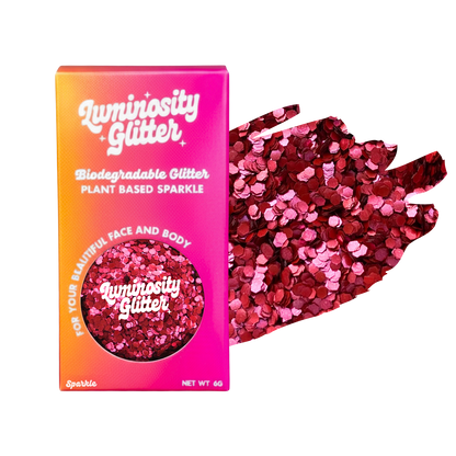 Luminosity Glitter packaging with red and pink glitter on a white background