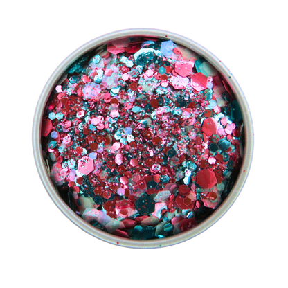 Colorful glitter mix in a round container on a white background