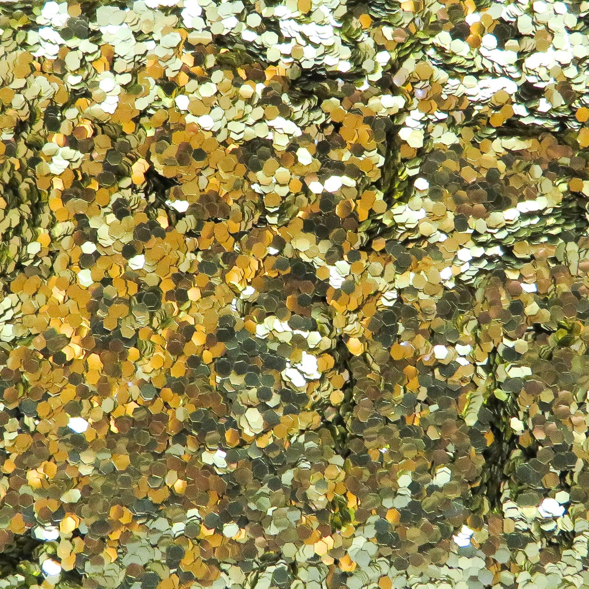 A close-up image of gold chunky eco glitter, showing various sizes of reflective gold particles.