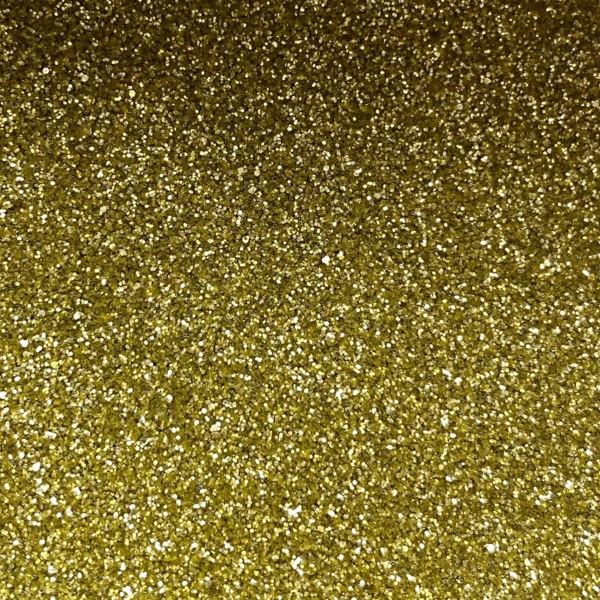 A close-up image of gold fine eco glitter, showing a dense, sparkling gold texture.