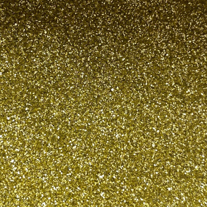 A close-up image of gold fine eco glitter, showing a dense, sparkling gold texture.