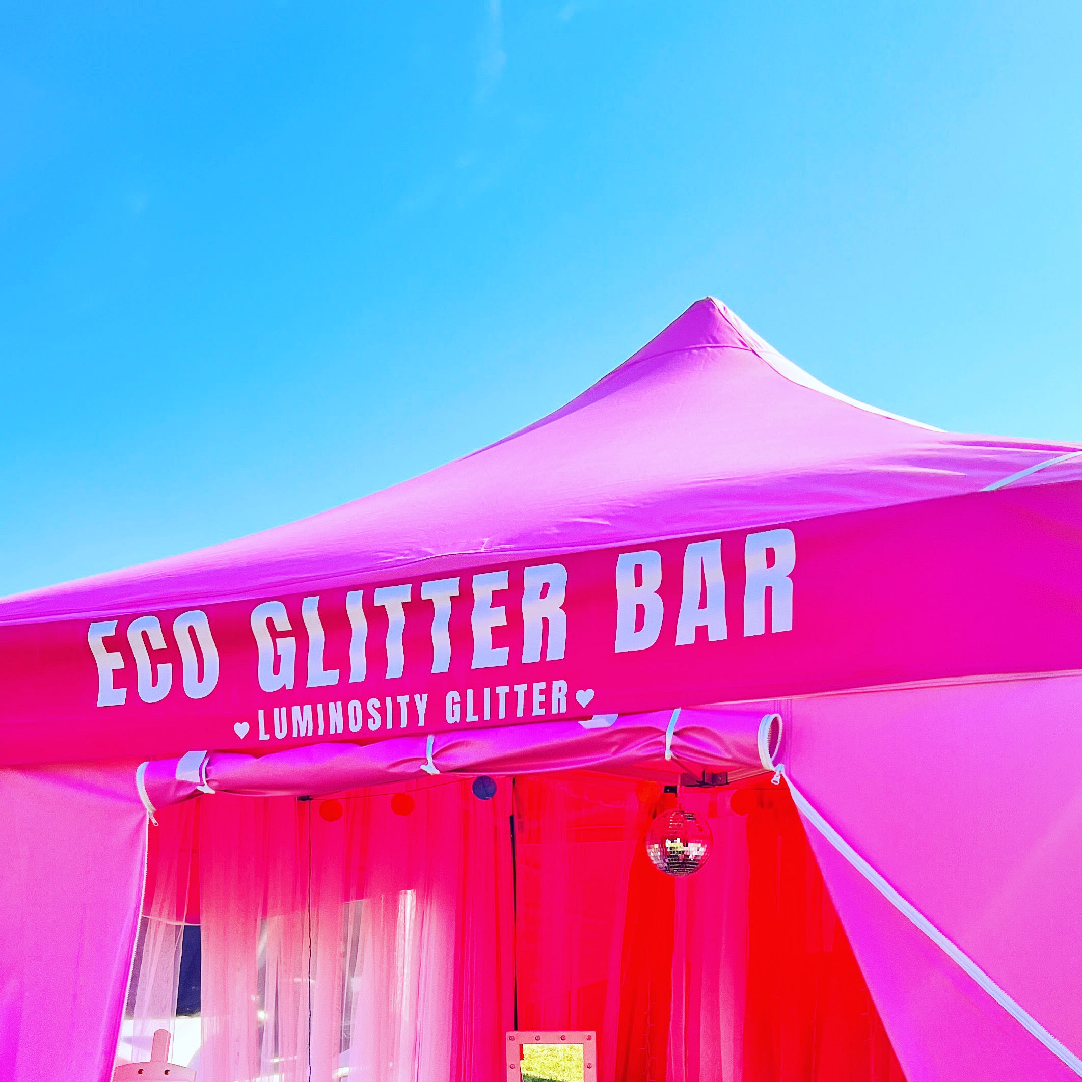 Fetival pink gazebo that says eco glitter bar Luminosity Glitter