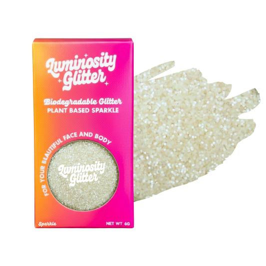 Luminosity Glitter packaging with biodegradable and plant-based sparkle on a white background