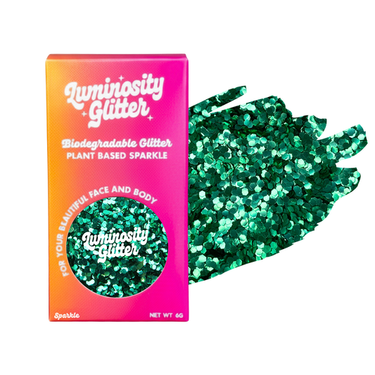 Luminosity Glitter packaging with green glitter on a white background