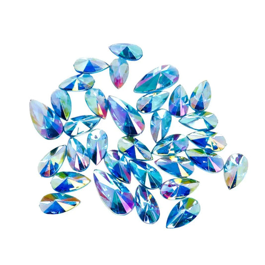 Ice blue face gems for festivals and parties. Apply with a cosmetic fixative. Iridescent blue face and body gems  that are reusable