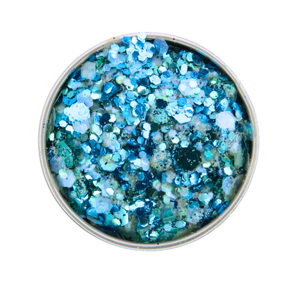 Blue glitter in a small round container on a white background