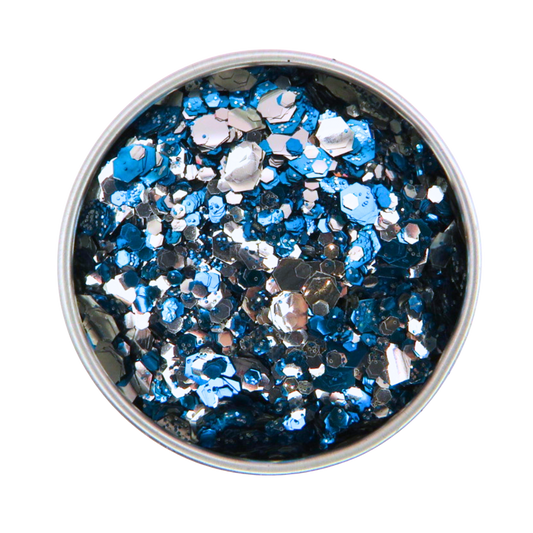Metallic blue and silver glitter in a round container on a white background