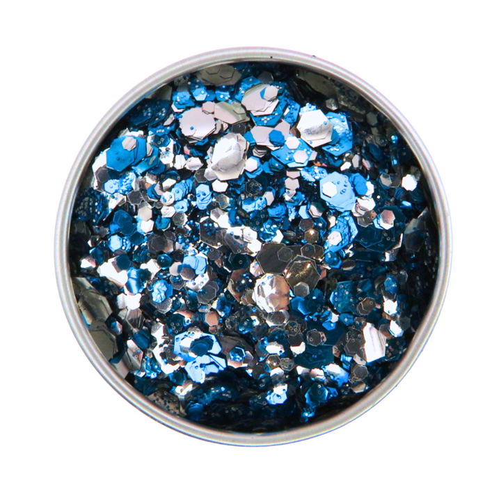 Metallic blue and silver glitter in a round container on a white background