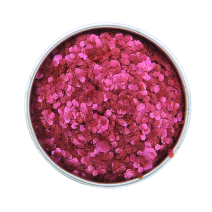 Pink glitter in a round container on a white background