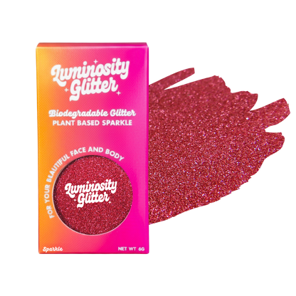 Luminosity Glitter packaging with red glitter on a white background